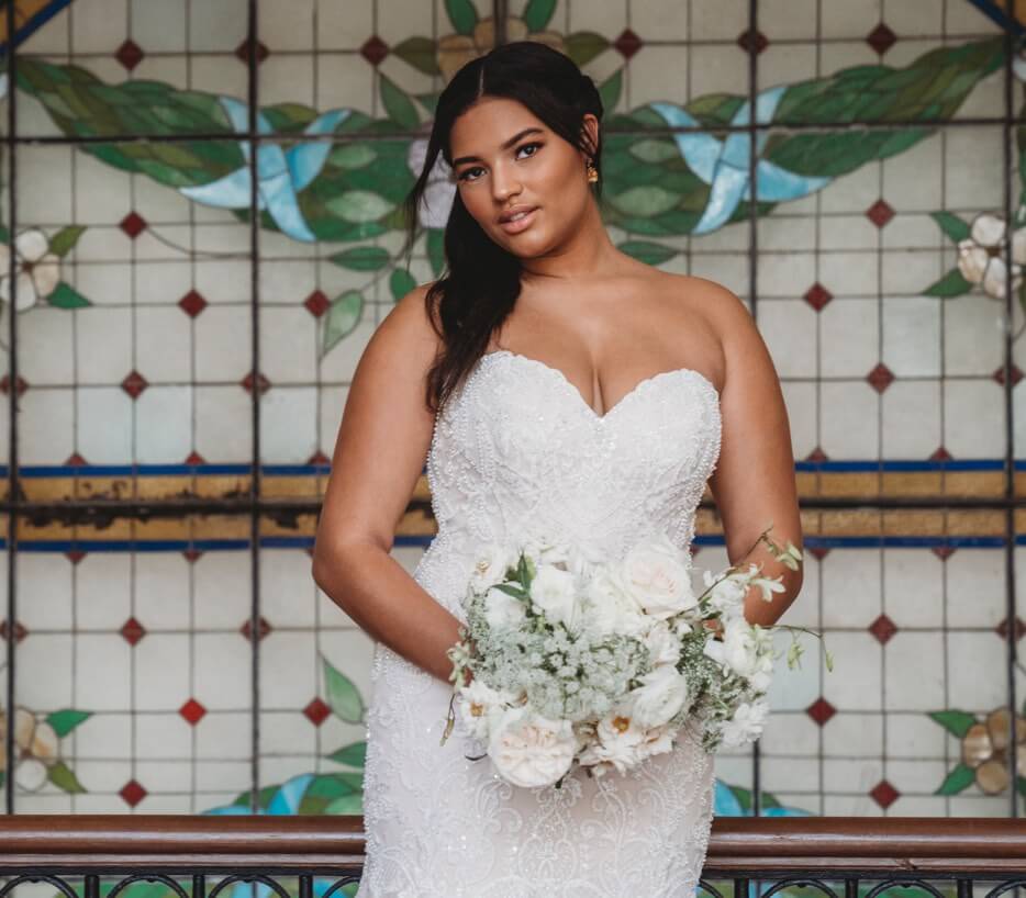 Photo of a plus-size bride in a white gown