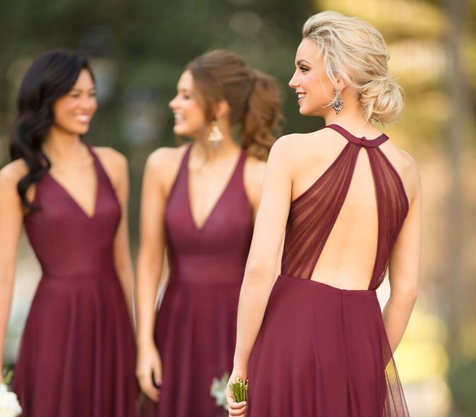 Bridesmaids wearing bordeaux dresses