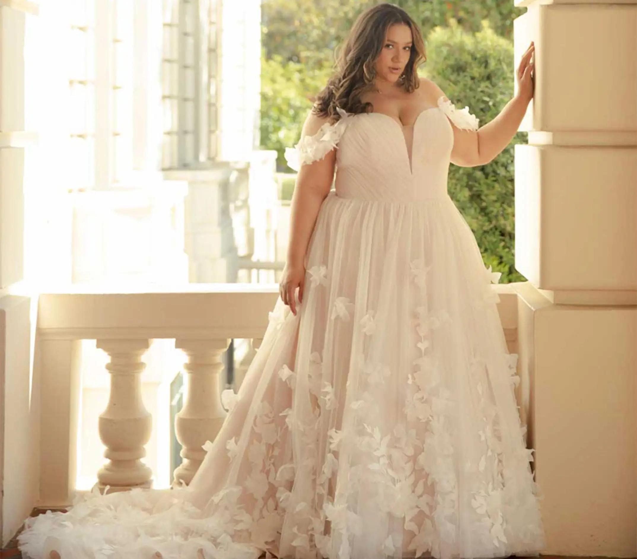 Photo of a plus-size bride in a white gown