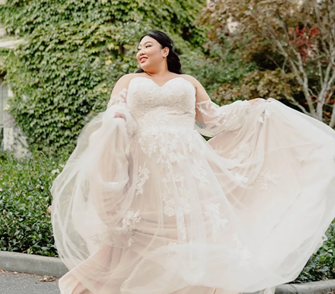 Photo of a plus-size bride in a white gown