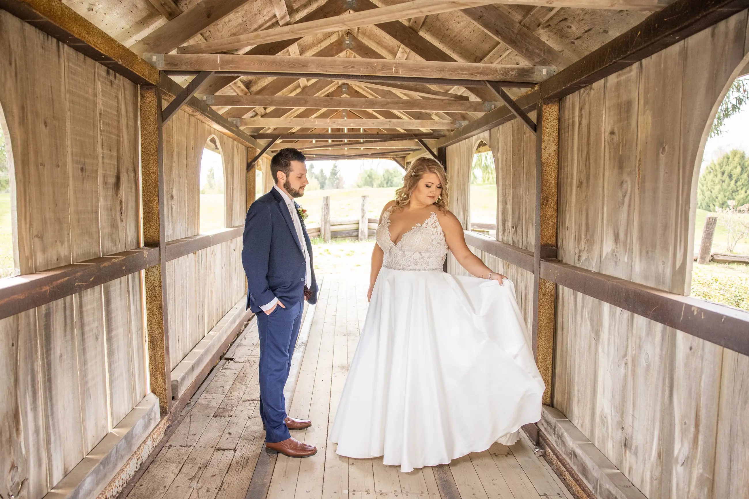 Bride posing with her husband